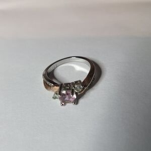 9.25 sterling silver piece featuring a central pink or light purple gemstone. 
